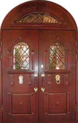 Стальная арочная дверь со стеклом и ковкой ДА-30 в дом из кирпича в Ступино